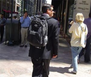 Wearing back pack with suit