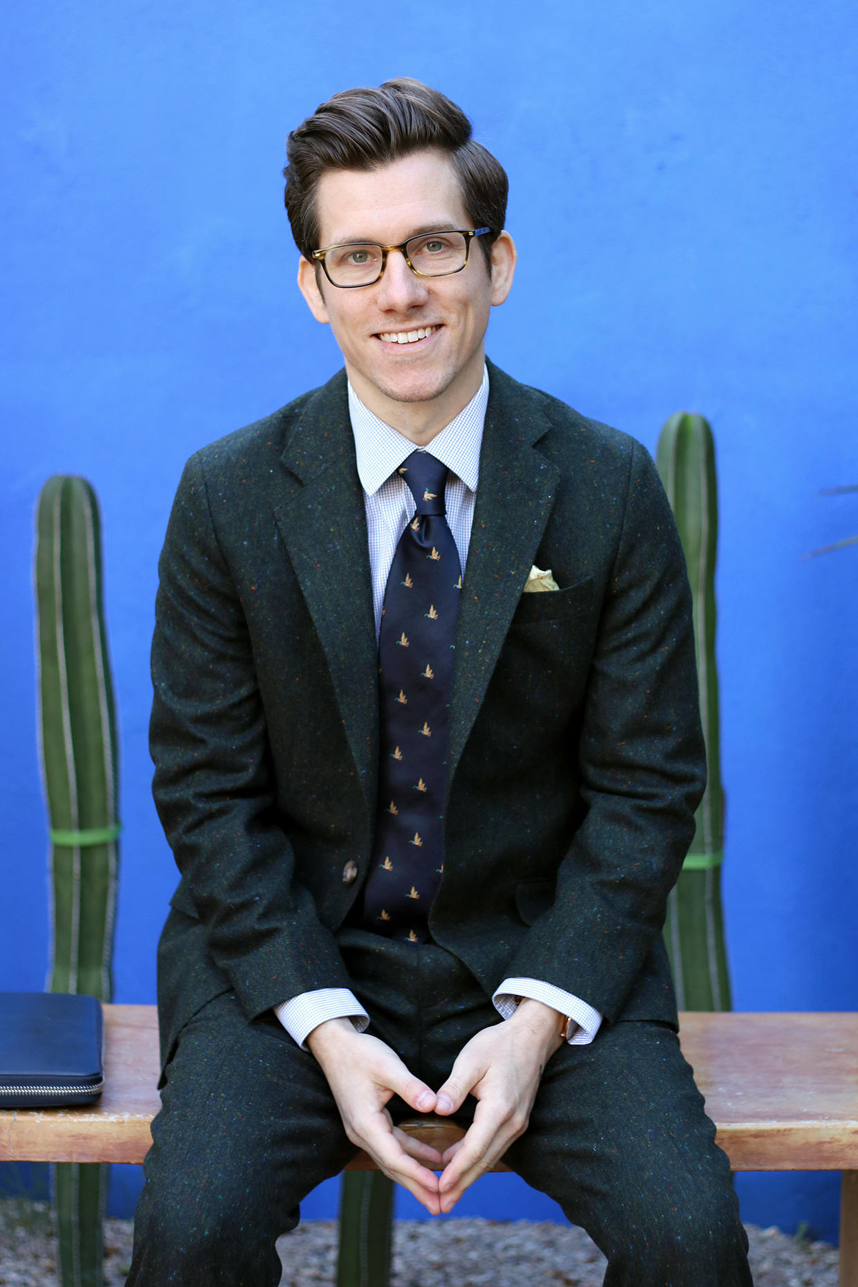 Green suit with navy tie