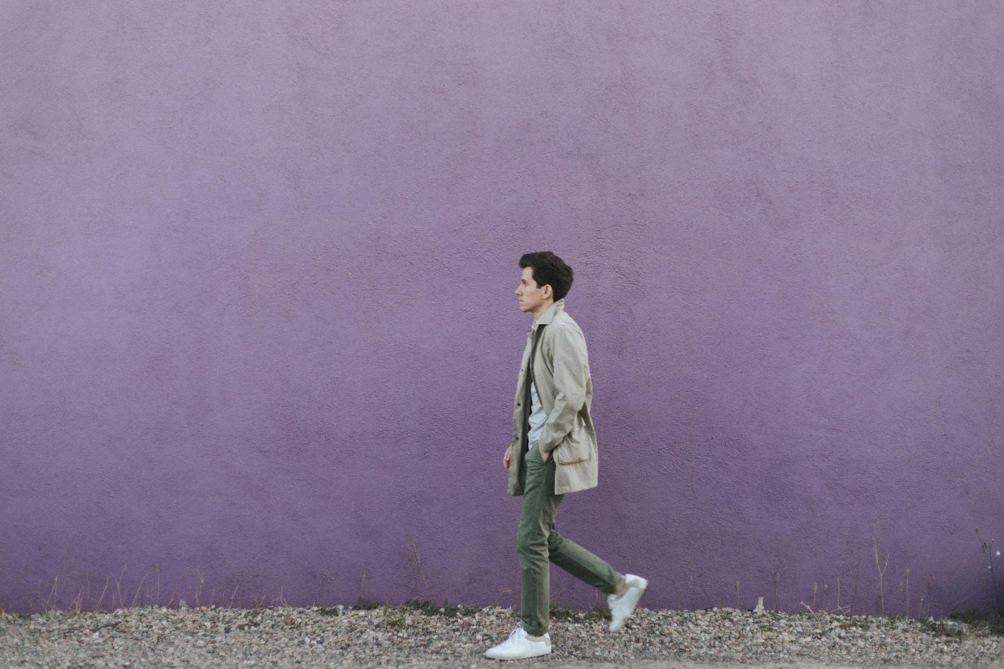 Walking in front of purple wall