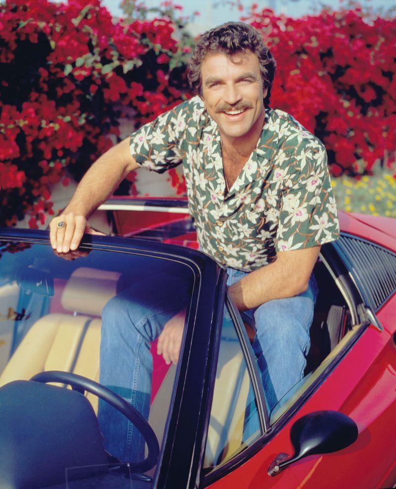 Tom Selleck wearing aloha shirt and jeans