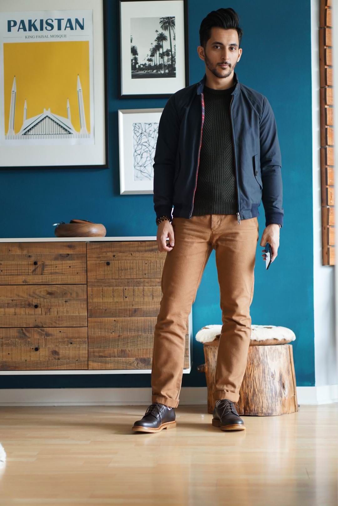 man wearing brown chinos and blue jacket