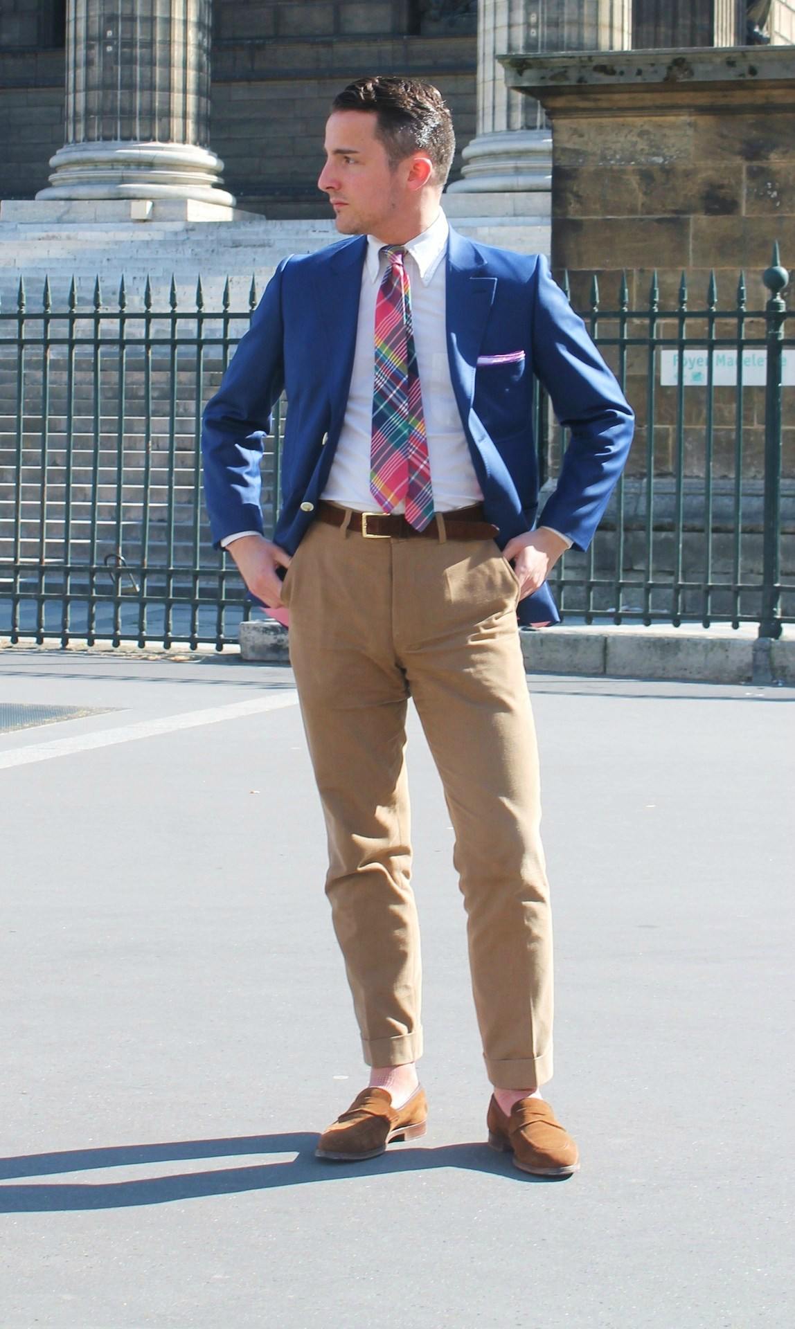 man wearing khaki chinos and colorful tie