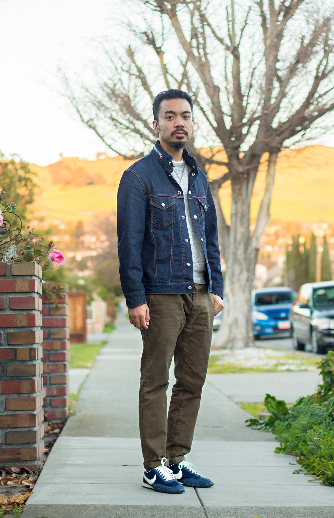 man wearing olive chinos