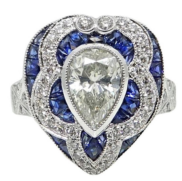 1.34 ct Pear Shaped Diamond and Sapphire Engagement Ring