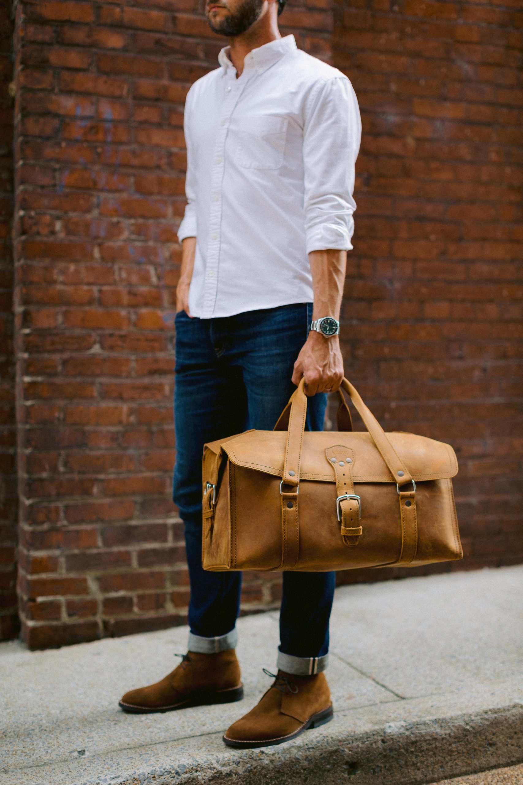 Saddleback duffle held from side