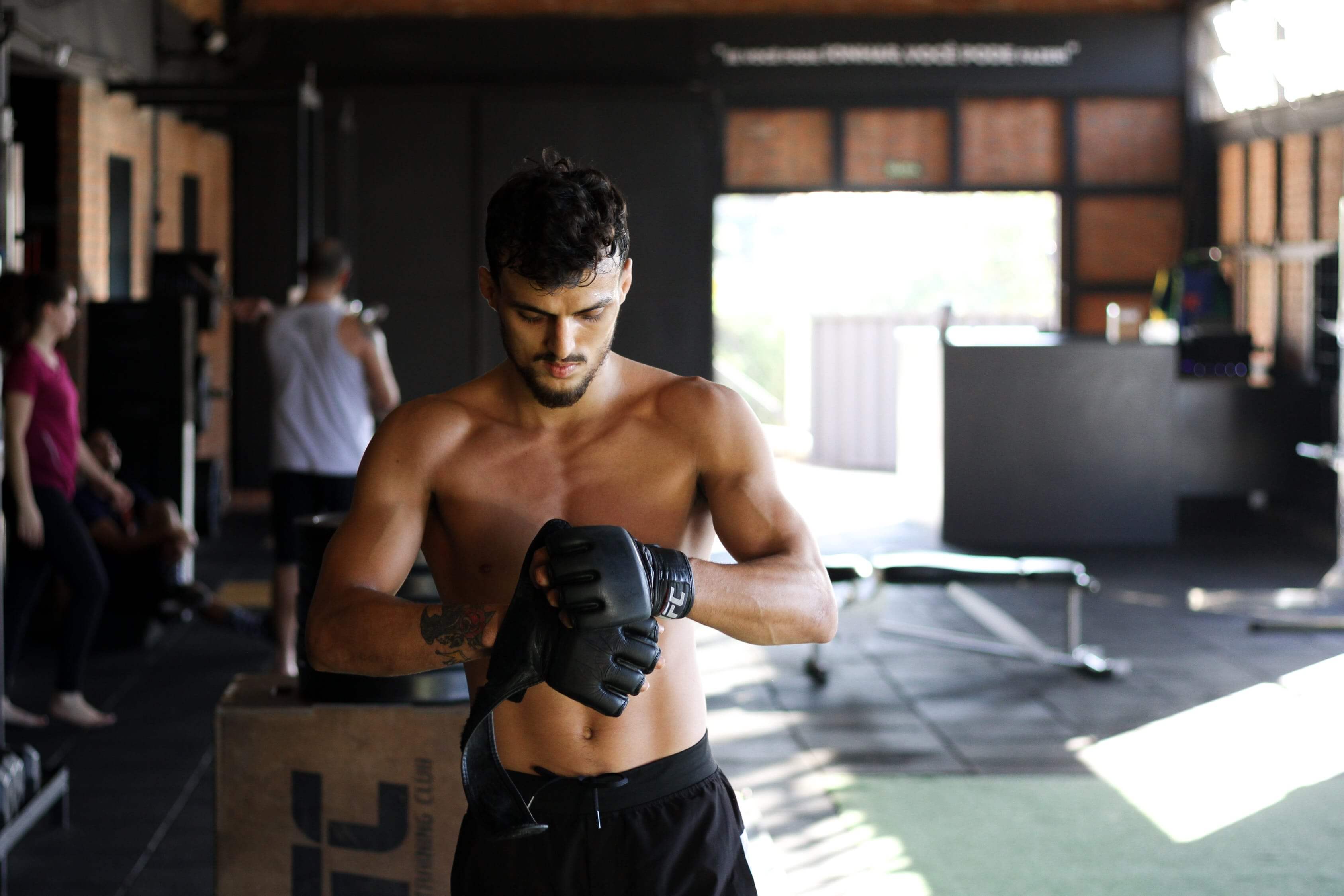 Martial artist with black gloves