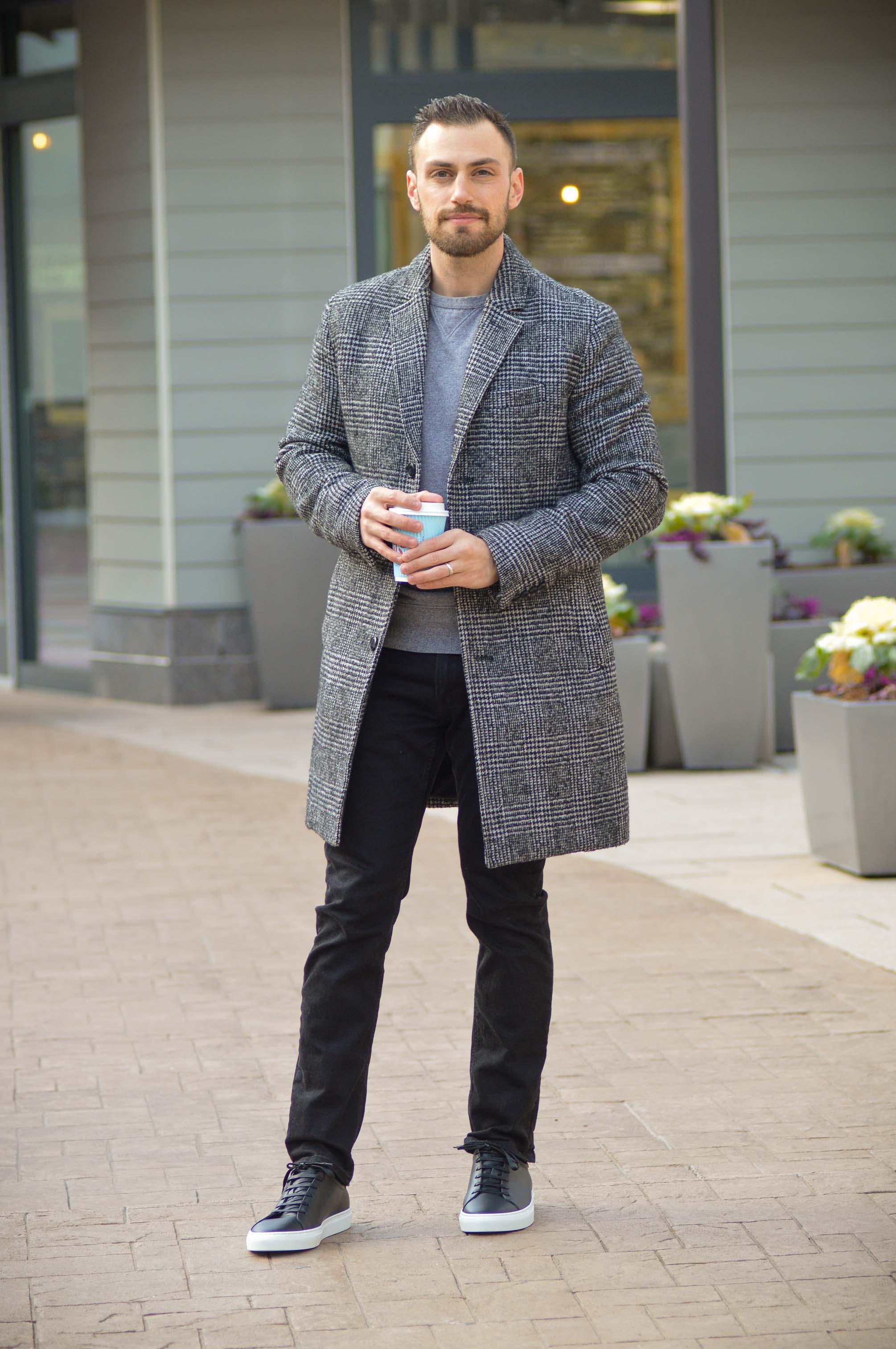 Wearing black leather sneakers