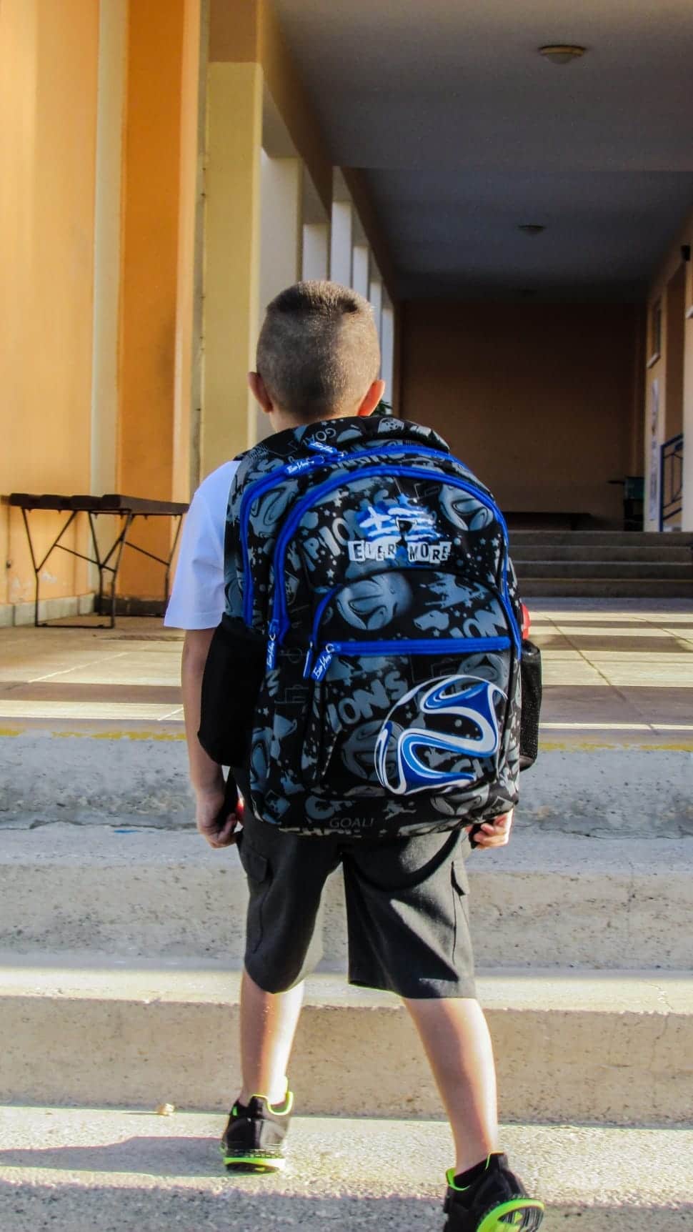 Kid with big backpack