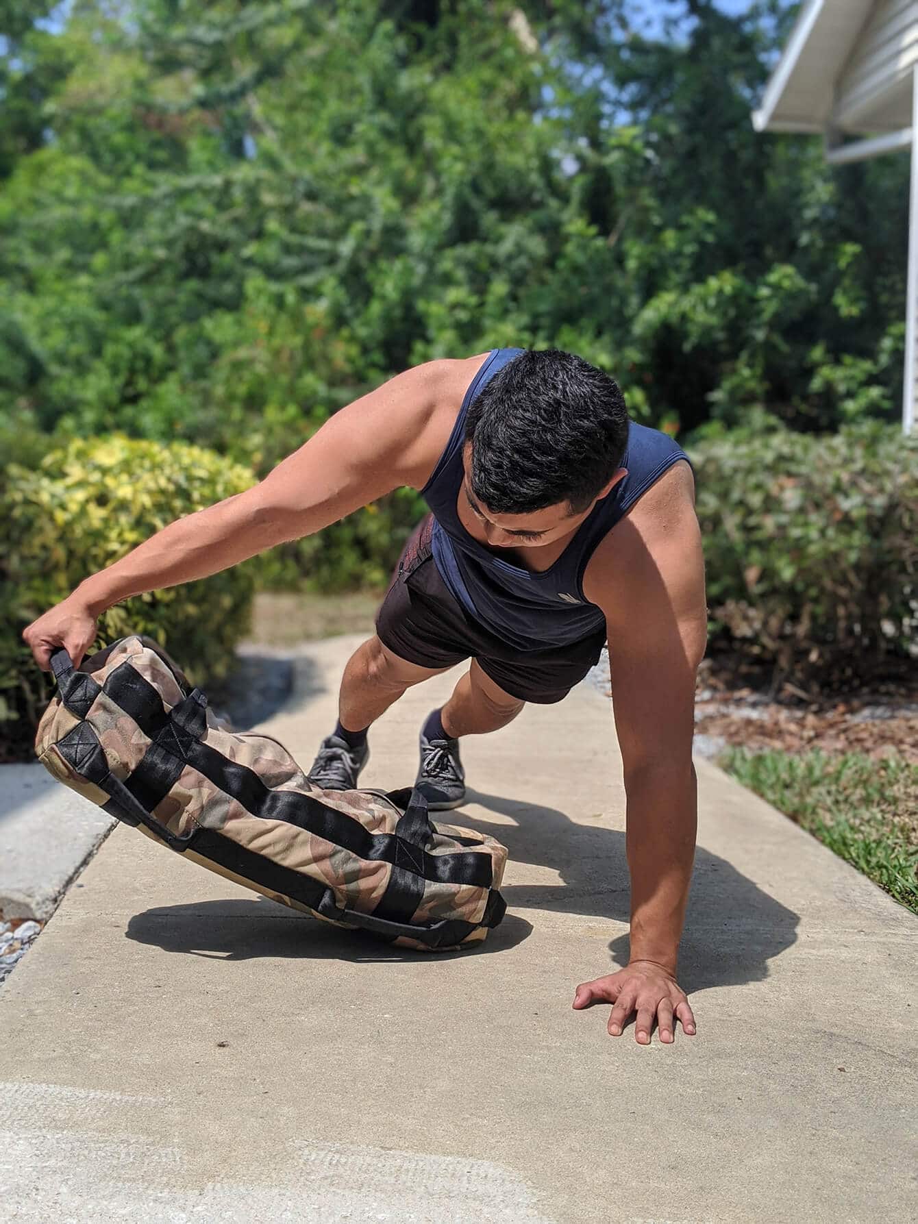 Sandbag workout on ground