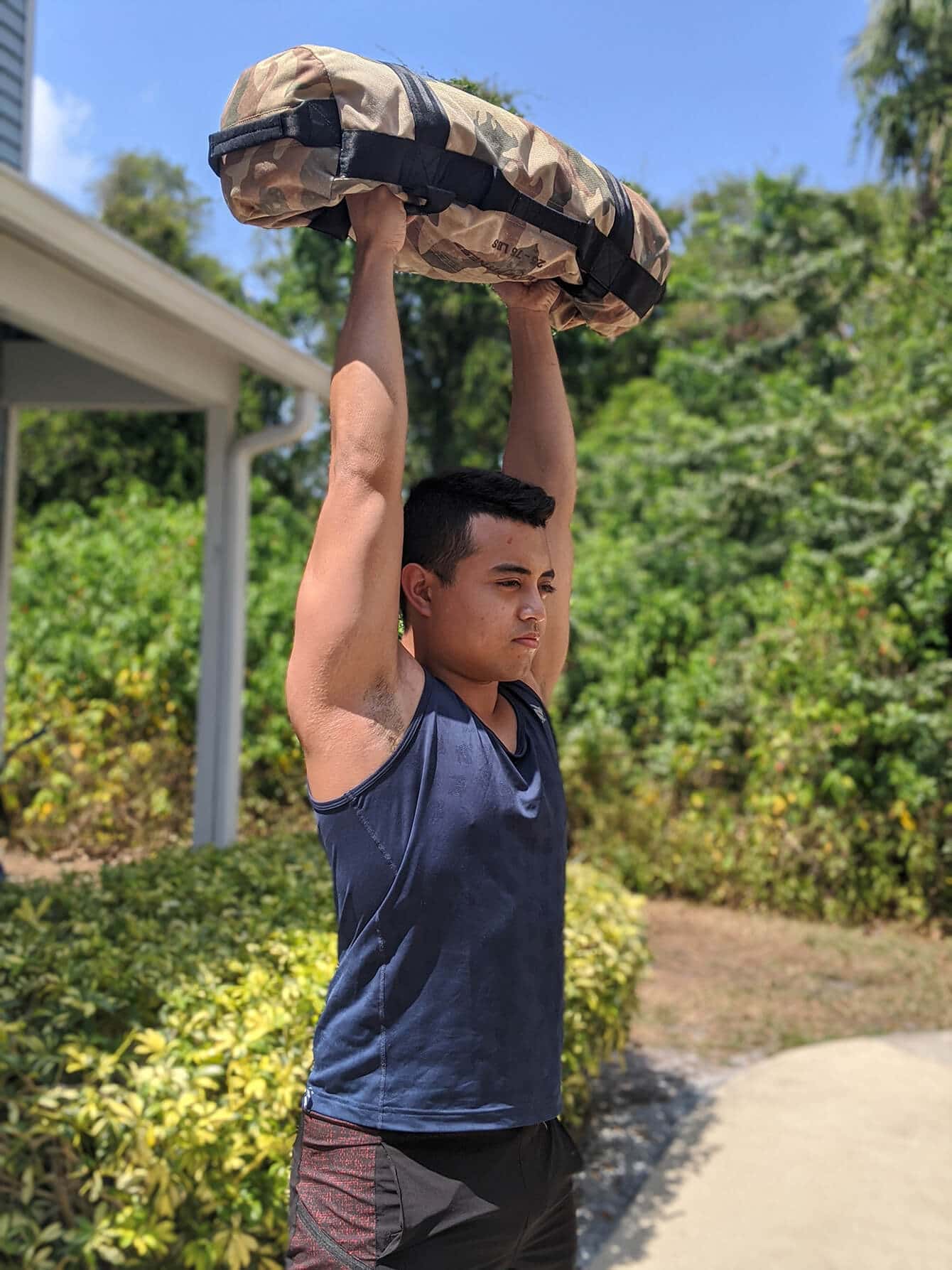 Sandbag shoulder press over head