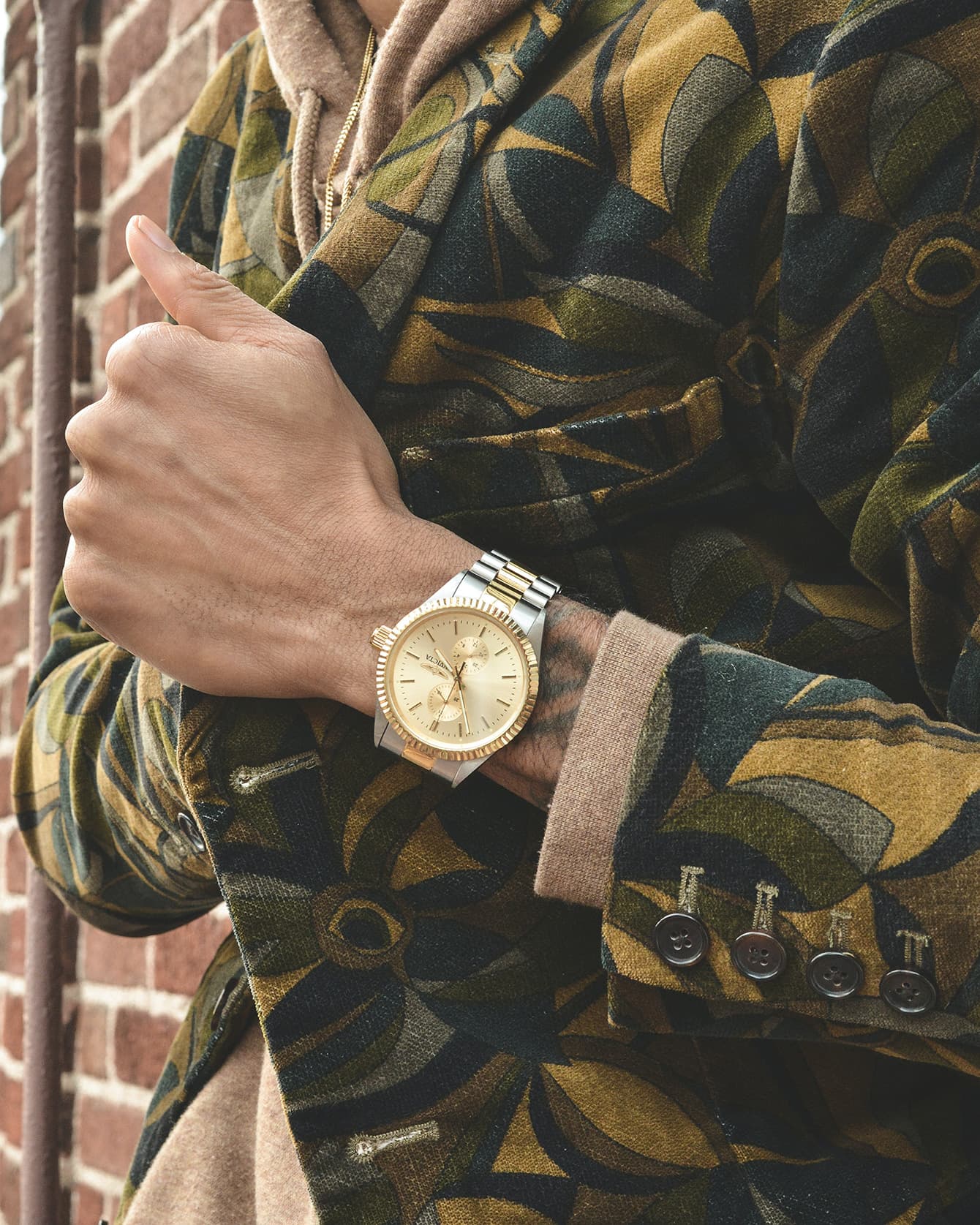 Man wearing two-tone watch