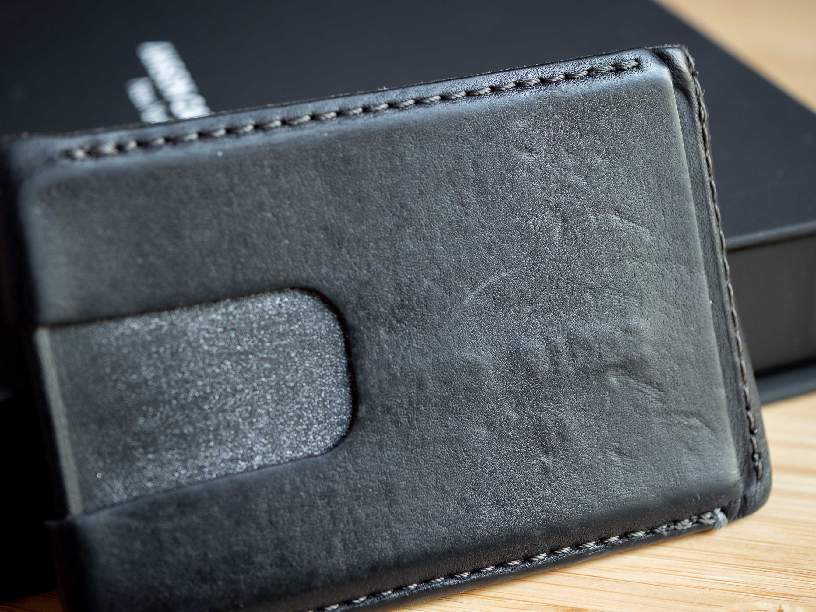 Black wallet patina