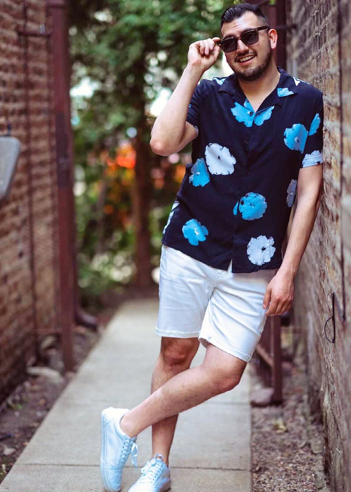 Steven Wearing a button down floral print