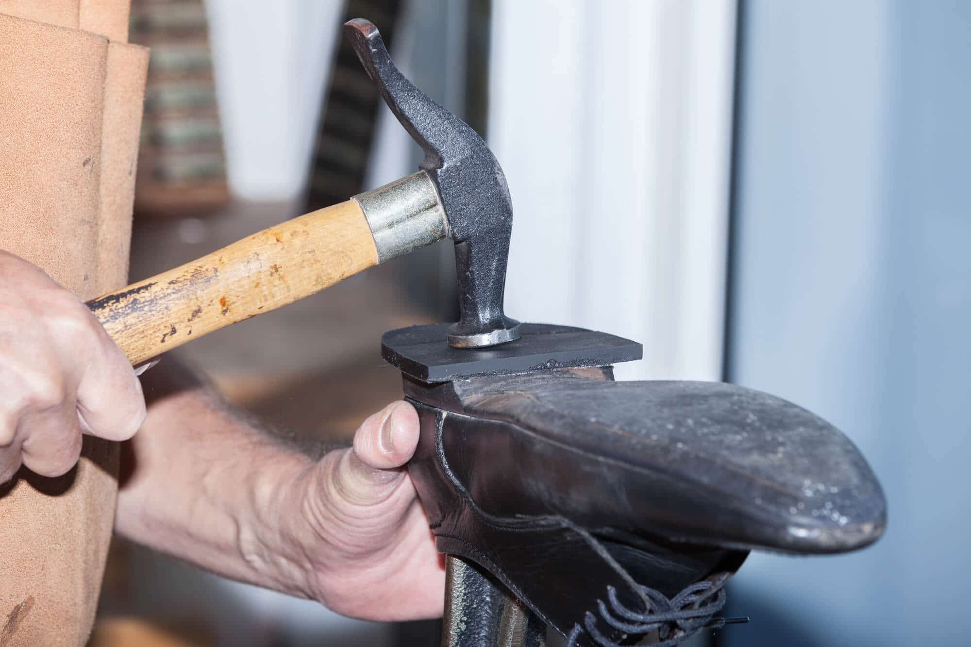 Cobbler repairing a heel