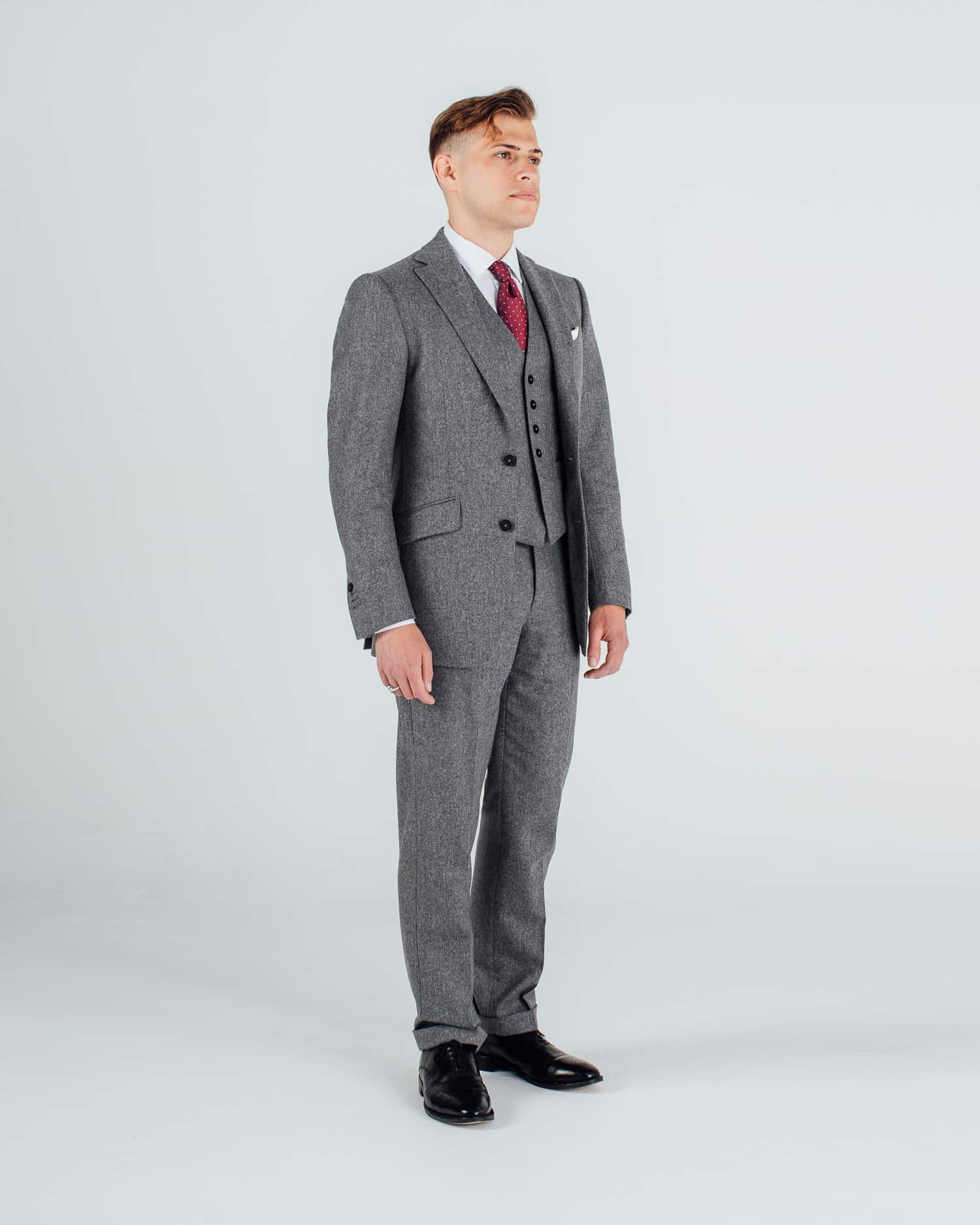 Ryan wearing grey flannel three piece suit