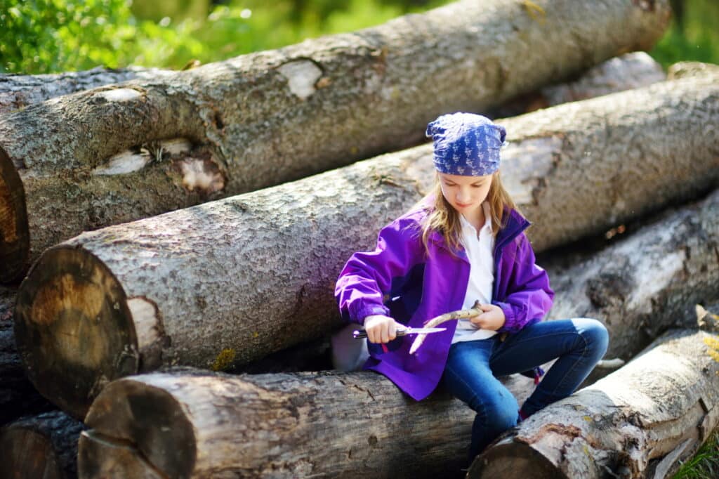 girl carving a stick